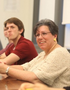 Rose Likins visits with students.