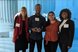 Center for Community Engagement Associate Director Sarah Dewees, A.J. Robinson, Stephanie Turcios and Amber Brown show off UMW’s Platinum Seal award at the 2019 ALL IN Campus Democracy Challenge Ceremony at the Newseum in Washington, D.C.