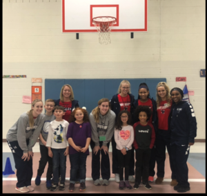 UMW Women's Basketball participates in a read-aloud with local students.