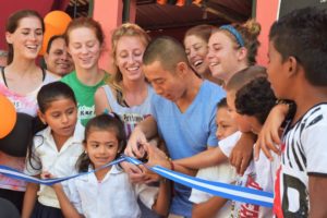 2007 alumnus Shin Fujiyama inaugurates a school built by his nonprofit, Students Helping Honduras, which he started at UMW. SHH has built 55 schools in the impoverished country, which is currently on lockdown. While much of his staff have been evacuated, Fujiyama stayed behind in Honduras to care for 24 orphaned children. Photo courtesy of SHH.