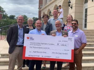 UMW employees, including President Paino, celebrate a gift to the Gwen Hale Resource Center.