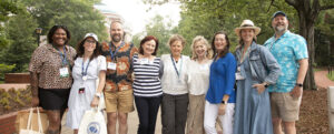 Rachel Selle ’05 (second from left) and fellow 2005 alumni join 1980 alumni for a photo on Campus Walk during Reunion Weekend. Photo by Karen Pearlman.